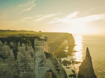 Panoramic view of rocks on sea against sky