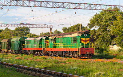 Train on railroad track against sky