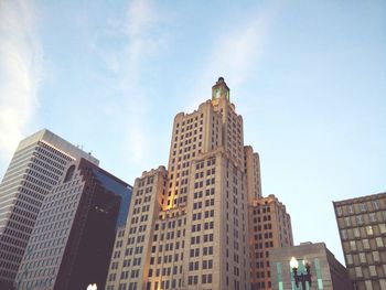 Low angle view of modern skyscrapers against sky