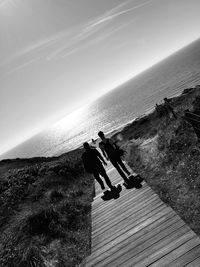 Low angle view of silhouette man against sky