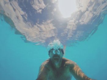 Portrait of man swimming in sea