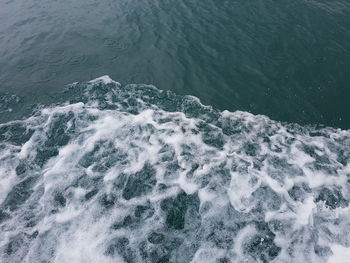 High angle view of waves breaking on sea