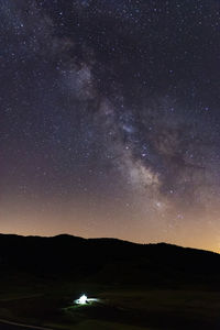 Scenic view of star field against sky at night