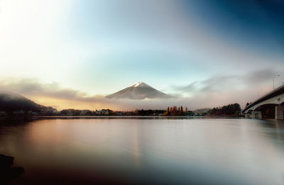 Scenic view of lake against cloudy sky