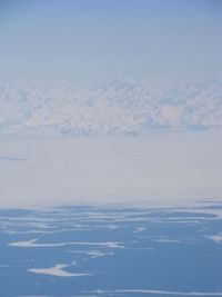 Scenic view of snow covered mountain against sky