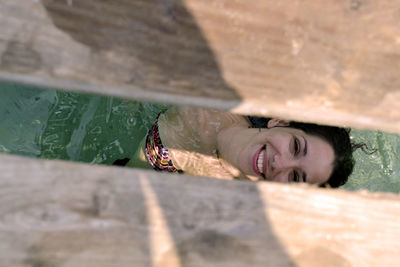 Close-up portrait of smiling young woman