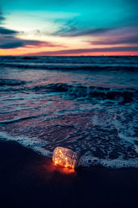 Scenic view of sea against sky at sunset