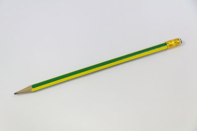 Close-up of colored pencils against white background