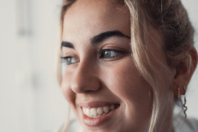 Close-up of young woman at home