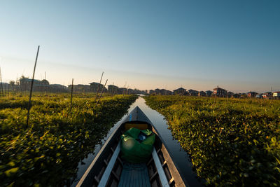 Scenic view of field against clear sky during sunset