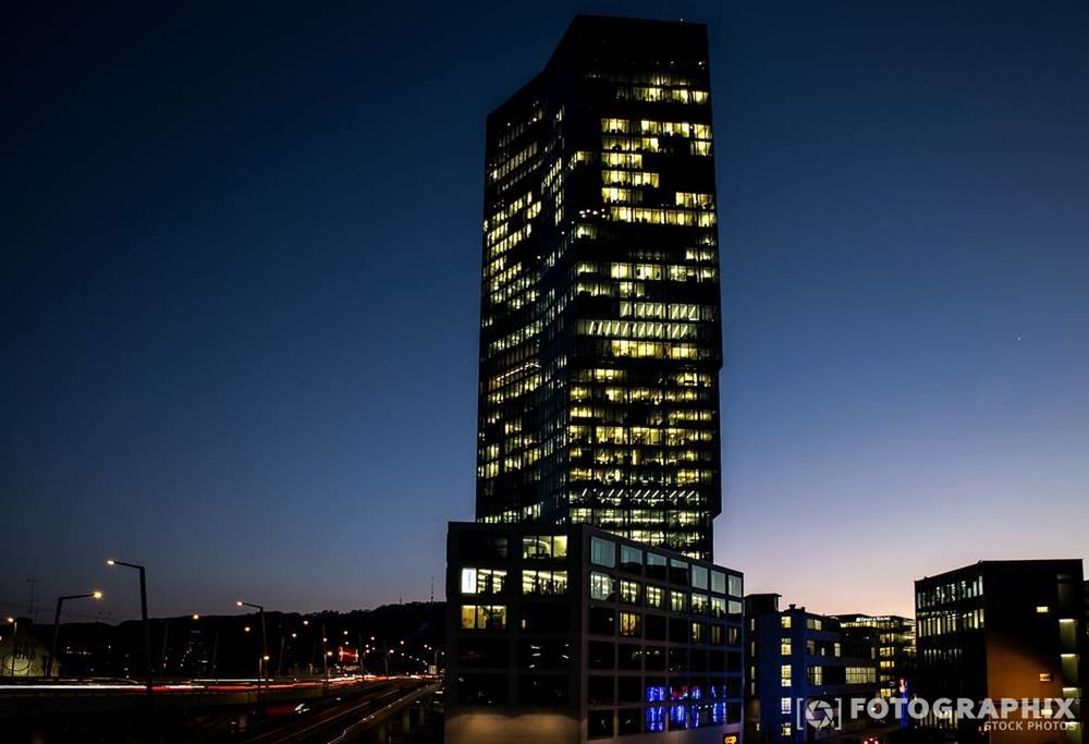 architecture, building exterior, illuminated, built structure, night, city, clear sky, low angle view, skyscraper, modern, tall - high, tower, office building, copy space, building, blue, city life, cityscape, sky, outdoors