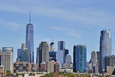 Skyscrapers in city against sky