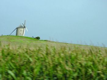 Wind turbines in field