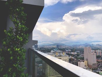 Buildings against sky seen from balcony