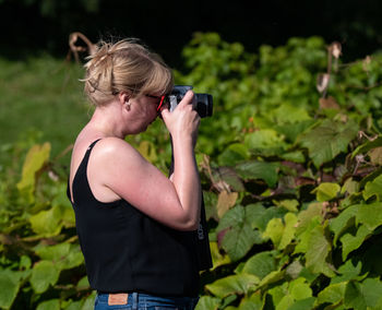 Full length of woman photographing