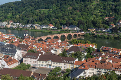 High angle view of townscape by river in town