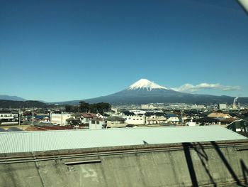 View of town against cloudy sky