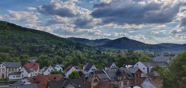 High angle view of townscape and mountains against sky