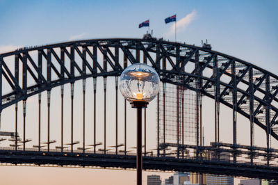 Street gas lighting against sydney harbour bridge on the background. sydney, australia