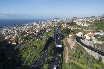 High angle view of street amidst buildings in city