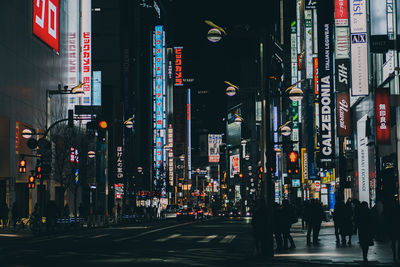 People walking on road in city