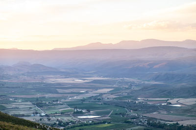 High angle view of townscape against sky during sunset