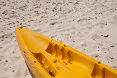 High angle view of yellow container on beach