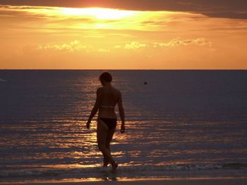 Full length of silhouette man on beach during sunset