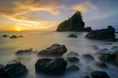 Scenic view of sea against sky during sunset