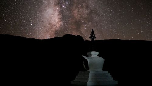 Built structure against sky at night