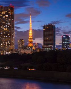 Illuminated buildings in city at night