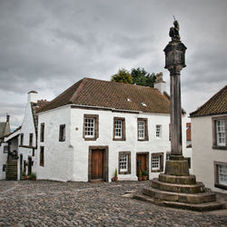 Exterior of houses and buildings against sky
