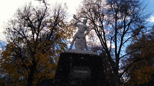 Low angle view of statue against sky