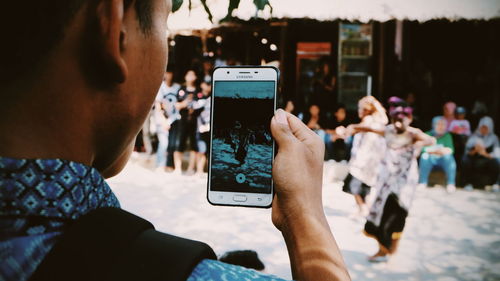 Group of people photographing with mobile phone