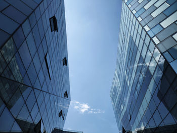 Low angle view of modern buildings against sky