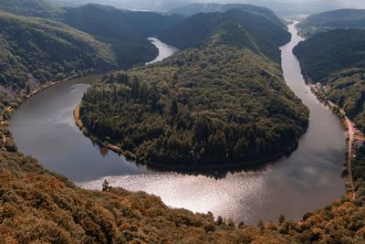 High angle view of river amidst mountains