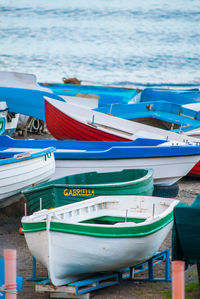 Row of boats moored at beach