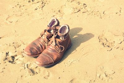 High angle view of shoes on sand