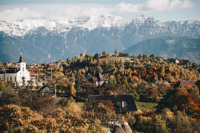 High angle view of houses in town against mountains