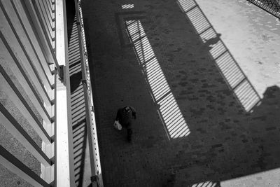 High angle view of man walking on staircase