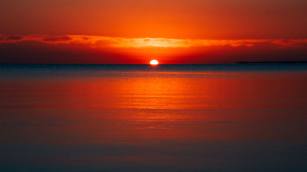 SCENIC VIEW OF SEA AGAINST ROMANTIC SKY