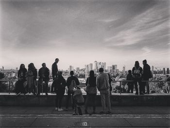 People standing in front of cityscape