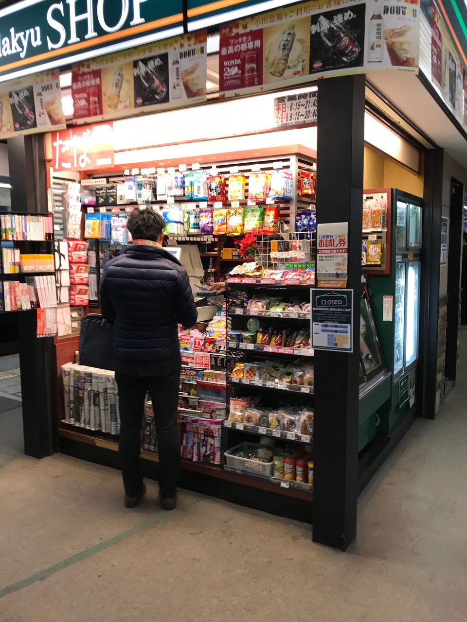 retail, rear view, one person, real people, store, choice, men, buying, business, variation, full length, for sale, shelf, customer, market, consumerism, supermarket, standing, small business, large group of objects, casual clothing, leisure activity, arrangement, lifestyles, indoors, food, one man only, vending machine, day, adult, people