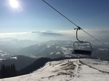 Overhead cable car against mountains during winter