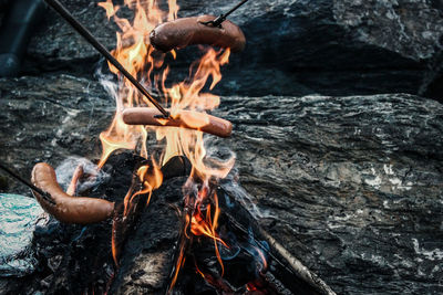 High angle view of fire on rock