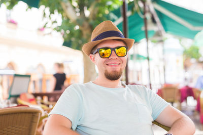 Portrait of young man wearing hat