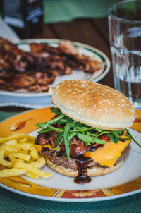 Close-up of hamburger in plate on table