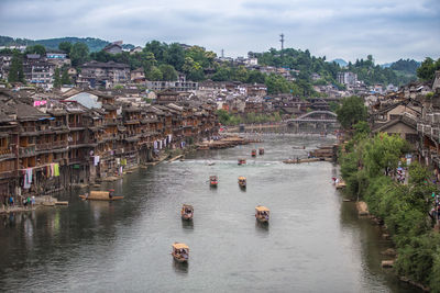 High angle view of river amidst buildings in city