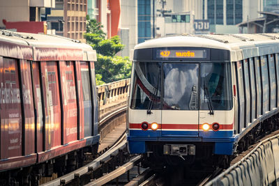 Train on railroad tracks in city