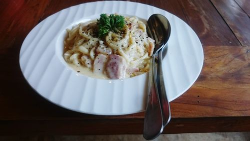 High angle view of fresh meal served in plate on table